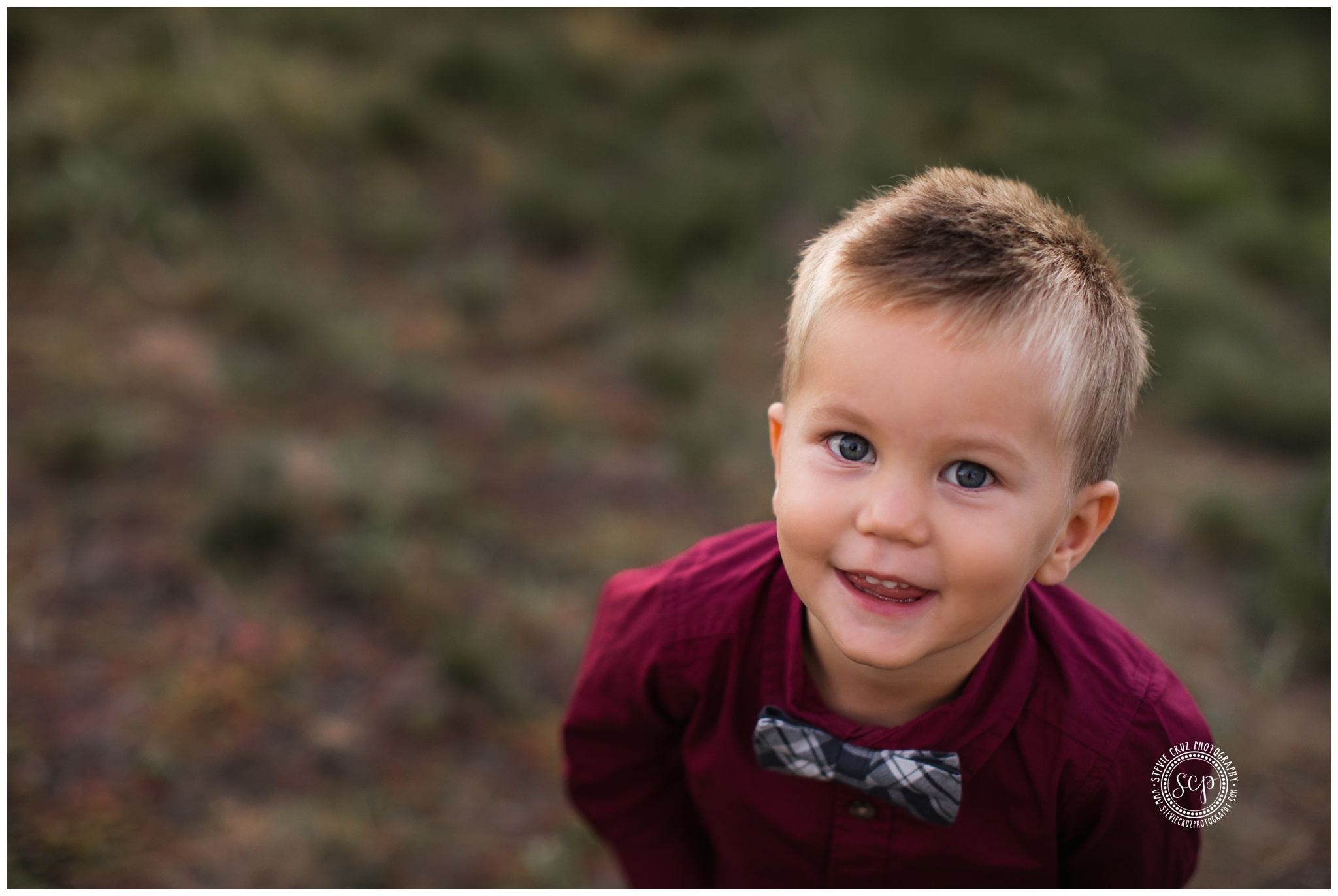 love the burgundy shirt and bow tie this boy wore for his family pictures 