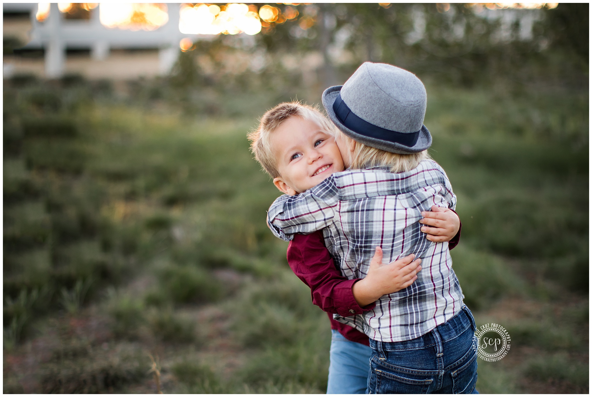Brothers hugging during their family portraits in southern California 