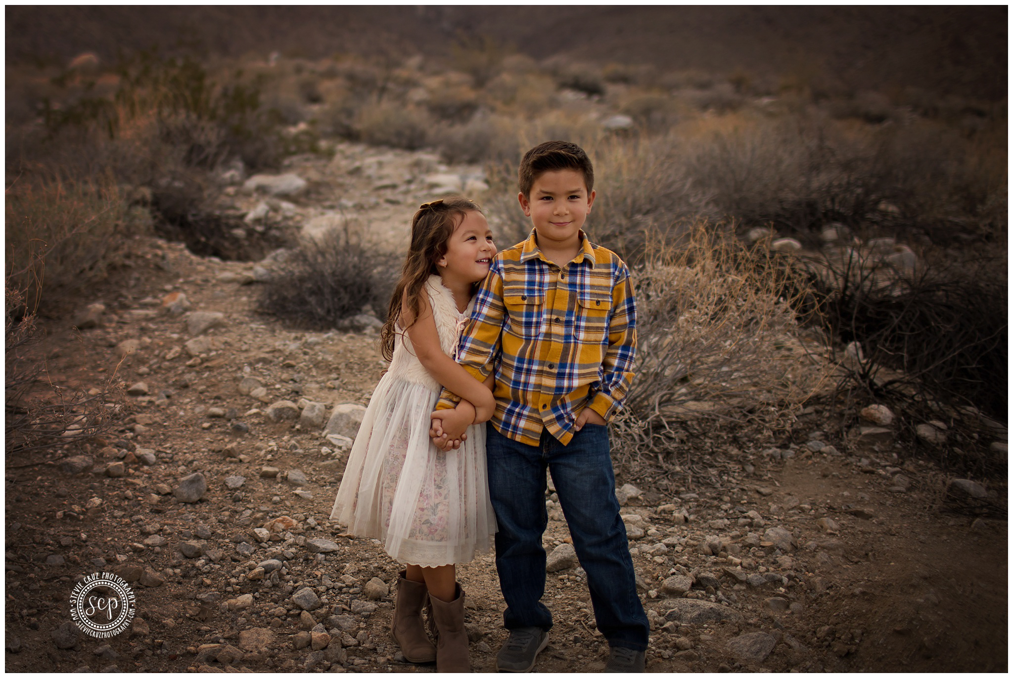 How cute is this portrait of brother and little sister, look how she admires her big brother? Photo captured in Palm Desert California 